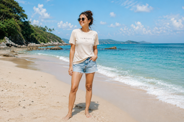 Young Woman in T-Shirt at Beach - graphicpicker.com